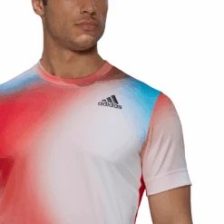 Adidas Men's Melbourne FreeLift Printed Top (White/Vivid Red/Black) 18 Adidas Men's Melbourne FreeLift Printed Top (White/Vivid Red/Black) -RACQUET GUYS Shop H67126 APP on model detail 1 white