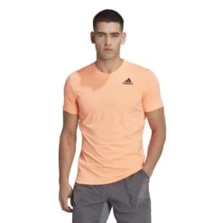 Adidas Men's New York Freelift Tee (Beam Orange) -RACQUET GUYS Shop HN9412 3 APPAREL OnModel StandardView white