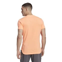 Adidas Men's New York Freelift Tee (Beam Orange) -RACQUET GUYS Shop HN9412 5 APPAREL OnModel BackView white